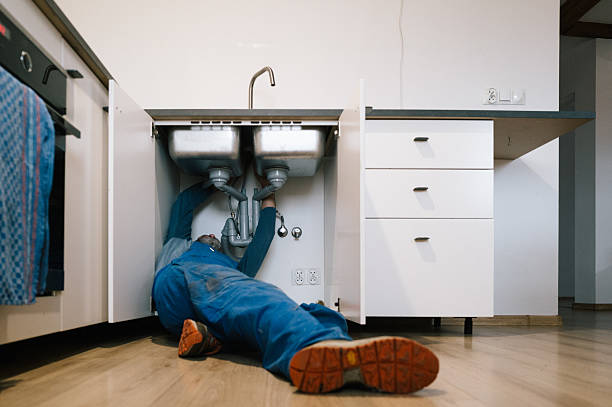 Professional Plumbing technician working in Roland, IA